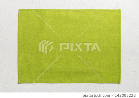 Top view of green tablecloth for food on cement background. Empty space for your design Top view of green tablecloth for food on cement background. Empty space for your design 142095228