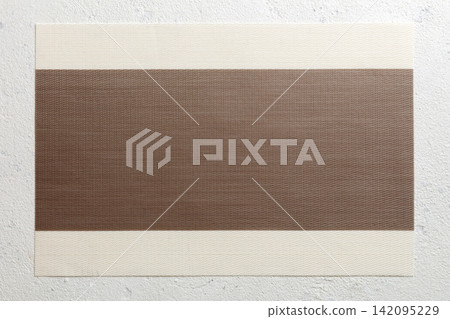 Top view of brown tablecloth for food on cement background. Empty space for your design Top view of brown tablecloth for food on cement background. Empty space for your design 142095229