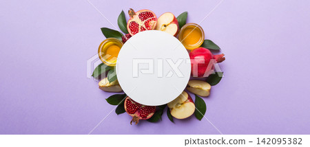 Flat lay composition with Blank flyer poster and symbols jewish Rosh Hashanah holiday attributes on colored background, New Year holiday Traditional. Top view with copy space mock up Flat lay composition with Blank flyer poster and symbols jewish Rosh Hashanah holiday attributes on colored background, New Year holiday Traditional. Top view with copy space mock up 142095382