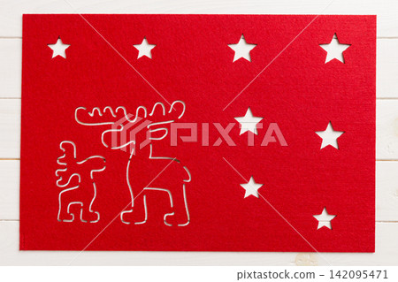Top view of red tablecloth for food on wooden background. Empty space for your design Top view of red tablecloth for food on wooden background. Empty space for your design 142095471