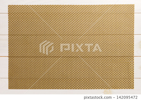 Top view of brown tablecloth for food on wooden background. Empty space for your design Top view of brown tablecloth for food on wooden background. Empty space for your design 142095472