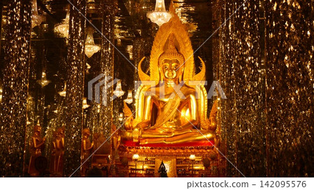Golden Buddha Statue Surrounded by Sparkling Mirror Pillars in Thai Glass Temple Hall Golden Buddha Statue Surrounded by Sparkling Mirror Pillars in Thai Glass Temple Hall 142095576