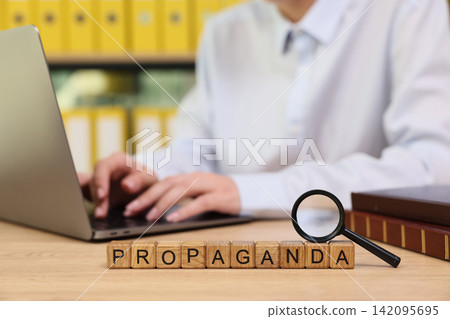 Exploring the meaning of propaganda in a modern workspace setting 142095695