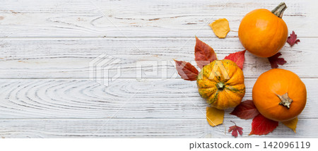 Autumn composition. Pattern made of dried leaves and other design accessories on table. Flat lay, top view Autumn composition. Pattern made of dried leaves and other design accessories on table. Flat lay, top view 142096119