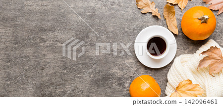 Flat lay composition with colorful Autumn cup of coffee and leaves on a color background. top view Flat lay composition with colorful Autumn cup of coffee and leaves on a color background. top view 142096461