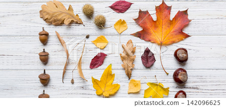 Autumn composition. Pattern made of dried leaves and other design accessories on table. Flat lay, top view 142096625