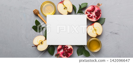 Flat lay composition with Blank flyer poster and symbols jewish Rosh Hashanah holiday attributes on colored background, New Year holiday Traditional. Top view with copy space mock up Flat lay composition with Blank flyer poster and symbols jewish Rosh Hashanah holiday attributes on colored background, New Year holiday Traditional. Top view with copy space mock up 142096647