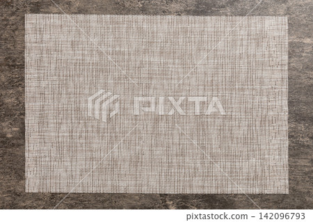 Top view of grey tablecloth for food on cement background. Empty space for your design Top view of grey tablecloth for food on cement background. Empty space for your design 142096793
