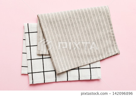 top view with gray kitchen napkin isolated on table background. Folded cloth for mockup with copy space, Flat lay. Minimal style 142096896