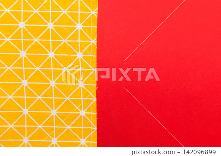 top view with yellow empty kitchen napkin isolated on table background. Folded cloth for mockup with copy space, Flat lay. Minimal style top view with yellow empty kitchen napkin isolated on table background. Folded cloth for mockup with copy space, Flat lay. Minimal style 142096899