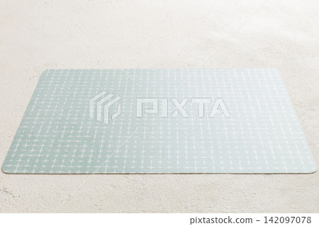 Perspective view of grey tablecloth for food on cement background. Empty space for your design Perspective view of grey tablecloth for food on cement background. Empty space for your design 142097078