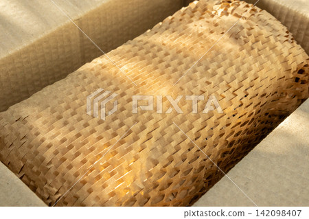 Eco friendly brown paper honeycomb wrap for product packaging parcel carton box Eco friendly brown paper honeycomb wrap for product packaging parcel carton box 142098407