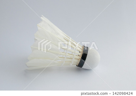 feather badminton shuttlecock on white paper texture background feather badminton shuttlecock on white paper texture background 142098424