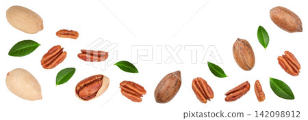 pecan nut decorated with green leaves isolated on white background. Top view. Flat lay pecan nut decorated with green leaves isolated on white background. Top view. Flat lay 142098912