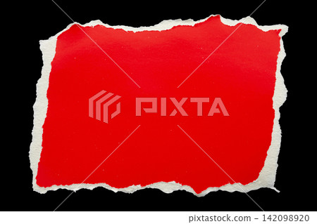 piece of red cardboard paper tear isolated on black background piece of red cardboard paper tear isolated on black background 142098920