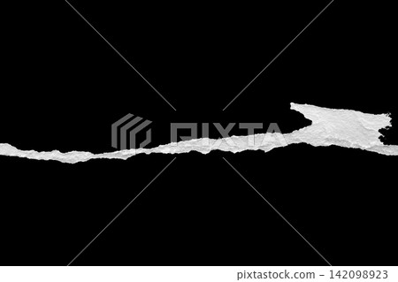 Ripped torn paper edges isolated on black background Ripped torn paper edges isolated on black background 142098923
