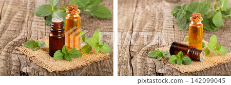 bottle of peppermint oil and fresh mint on an old wooden background bottle of peppermint oil and fresh mint on an old wooden background 142099045