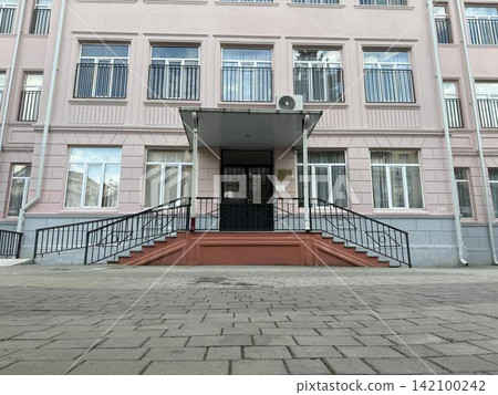 a building with a clock on the front of it a building with a clock on the front of it 142100242