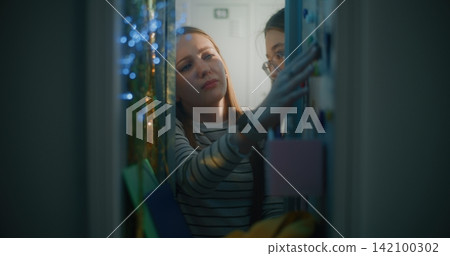 Teenage Girl Opens Personal Locker and Belongings when Classmate Casually Converses Teenage Girl Opens Personal Locker and Belongings when Classmate Casually Converses 142100302