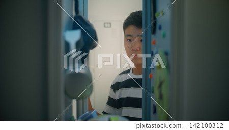 Teenage Student Opens Door, Reaches for Smartphone and Chats Teenage Student Opens Door, Reaches for Smartphone and Chats 142100312