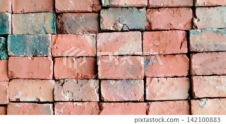 Weathered red brick wall texture with a rustic industrial pattern. Weathered red brick wall texture with a rustic industrial pattern. 142100883