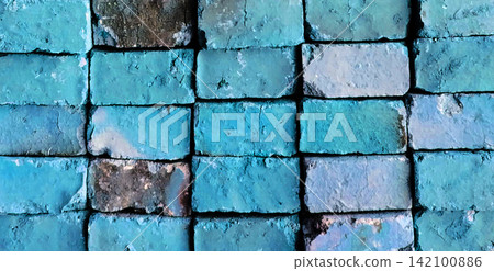 Weathered turquoise brick wall texture with peeling paint 142100886
