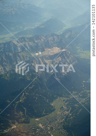 Aerial view of rugged Swiss Alps and glacial valleys Aerial view of rugged Swiss Alps and glacial valleys 142101135