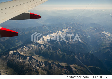 Switzerland, July 25, 2026: Aerial view of rugged Swiss Alps mountain landscape with valleys and alpine terrain, travel and tourism Switzerland, July 25, 2026: Aerial view of rugged Swiss Alps mountain landscape with valleys and alpine terrain, travel and tourism 142101176