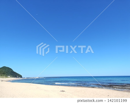 beautiful sandy beach and blue sea beautiful sandy beach and blue sea 142101199