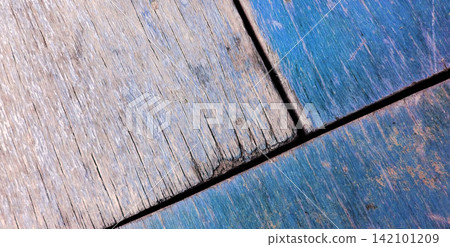 Natural wood plank texture and a blue finish with a distressed look. Natural wood plank texture and a blue finish with a distressed look. 142101209