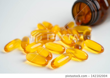 Fish oil or Cod liver oil gel in capsules with omega 3 vitamins, supplementary healthy food. Fish oil or Cod liver oil gel in capsules with omega 3 vitamins, supplementary healthy food. 142102004