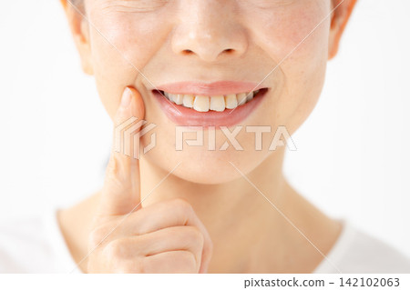 Woman's mouth, smiling. Woman's mouth, smiling. 142102063