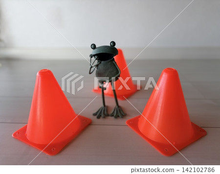 The tin frog in danger The tin frog in danger 142102786