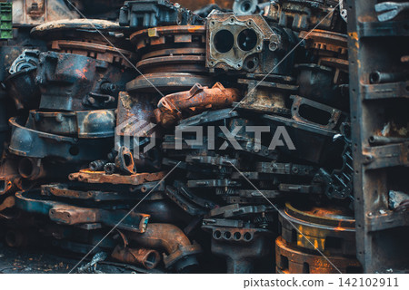 rusty automotive and motorcycle parts piled in industrial scrapyard metal recycling zone, damaged mechanical components and corroded vehicle machinery in salvage dump background rusty automotive and motorcycle parts piled in industrial scrapyard metal recycling zone, damaged mechanical components and corroded vehicle machinery in salvage dump background 142102911