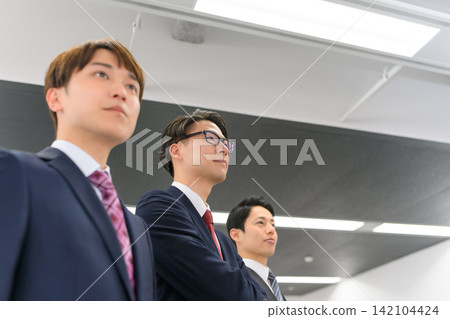 Three men in suits, their business resolve Three men in suits, their business resolve 142104424
