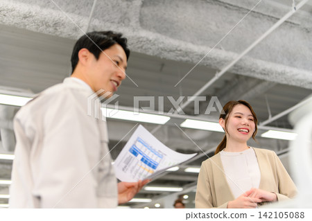 Business people conversing with a smile Business people conversing with a smile 142105088