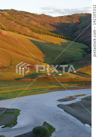 A landscape of the Orkhon River and yurts illuminated by the morning sun, Karakorum, Mongolia. A landscape of the Orkhon River and yurts illuminated by the morning sun, Karakorum, Mongolia. 142105312