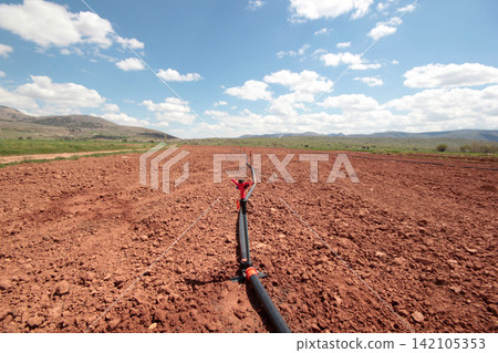 Irrigation system, water saving irrigation system agricultural background Irrigation system, water saving irrigation system agricultural background 142105353