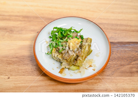 Grilled eggplant made with long eggplants, served with condiments. Grilled eggplant made with long eggplants, served with condiments. 142105370