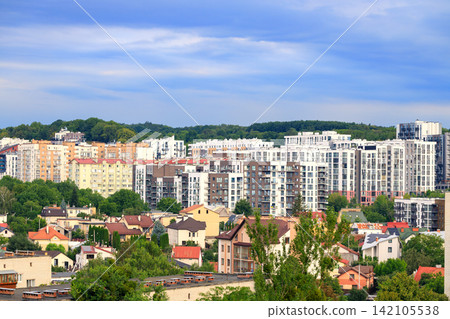Panoramic aerial view of a dense urban neighborhood with apartment buildings and houses expansive vista of modern high-rise apartments Panoramic aerial view of a dense urban neighborhood with apartment buildings and houses expansive vista of modern high-rise apartments 142105538