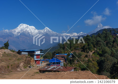Trekking in Mardi Himal, Nepal: Beautiful views of the Himalayas and Annapurna from a mountain hut. Trekking in Mardi Himal, Nepal: Beautiful views of the Himalayas and Annapurna from a mountain hut. 142106079