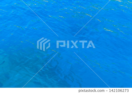 Blue water texture background. Surface of the sea 142106273