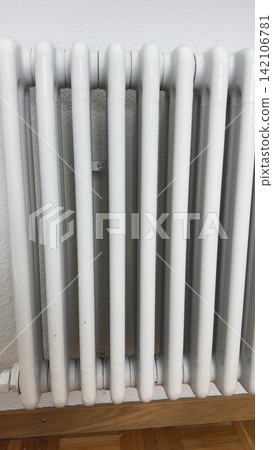 Close up of white heating radiator after home repair and painting renovation process clean metal heater interior detail Close up of white heating radiator after home repair and painting renovation process clean metal heater interior detail 142106781