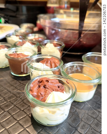 Portioned desserts in glasses on the table Portioned desserts in glasses on the table 142106783