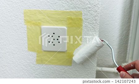 Painting wall around masked power socket with small roller home renovation and repair step interior refresh careful edge work clean modern design Painting wall around masked power socket with small roller home renovation and repair step interior refresh careful edge work clean modern design 142107243
