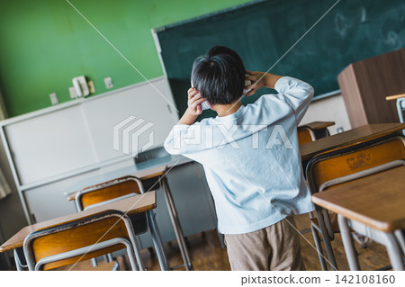 Children wearing headphones in the classroom Children wearing headphones in the classroom 142108160