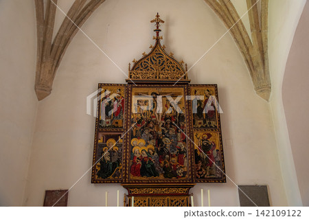 Hallstatt, Austria. A beautiful altarpiece of the Crucifixion of Christ inside the Church of Maria am Berg. Hallstatt, Austria. A beautiful altarpiece of the Crucifixion of Christ inside the Church of Maria am Berg. 142109122