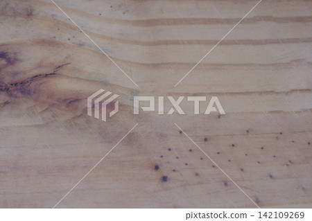 Natural wood grain creating a textured background, highlighting organic patterns, knots, and a light brown rustic timber surface with unique imperfections and details Natural wood grain creating a textured background, highlighting organic patterns, knots, and a light brown rustic timber surface with unique imperfections and details 142109269