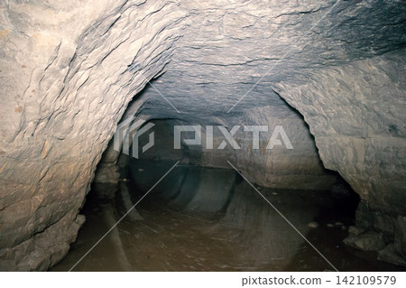 partially flooded underground caves catacomb 142109579