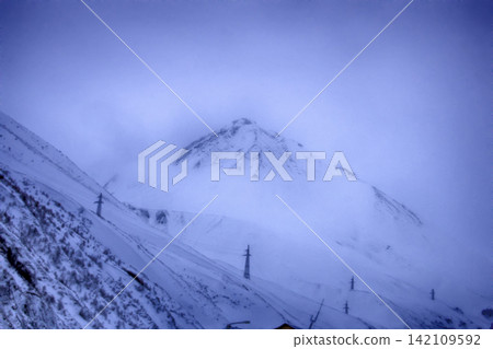 Winter snow covered mountain region of peak Kazbegi in Caucasus mountains. Winter snow covered mountain region of peak Kazbegi in Caucasus mountains. 142109592